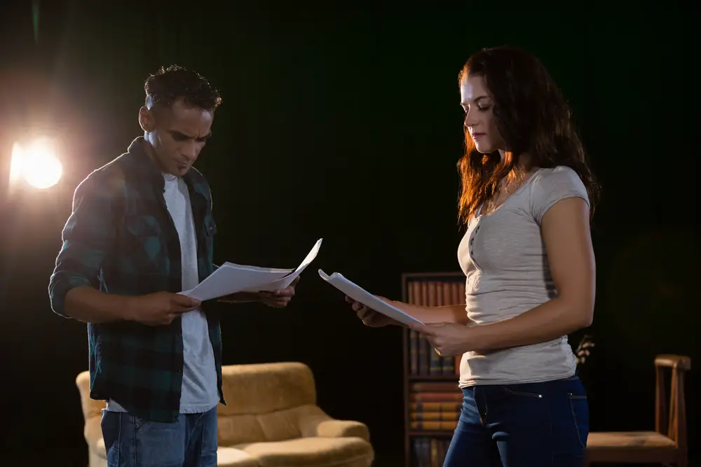 Actors,Reading,Their,Scripts,On,Stage,In,Theatre